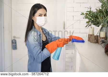 A Woman With Cleaning Gloves Using Alcohol Spray Sanitiser To Cleaning House, Healthy And Medical, C