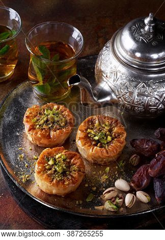 Middle Eastern, Arab Sweet Pastry Phyllo Nests Baklava, Different Delights, Dried Dates, Pistachios,