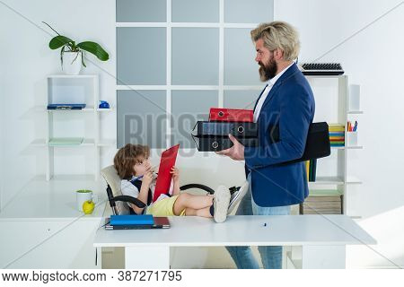 Boss And Employee. Little Boss And Mature Employee In The Office. Old And Yong Business Concept. Bus