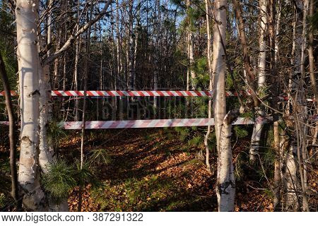 Red And White Striped Warning About Danger And Limited Access Tape Tape. Red And White Striped Stret