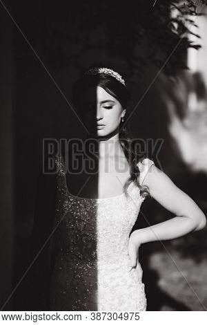 Black And White Photo Of Gorgeous Model. Hulf Of Face In Shadow