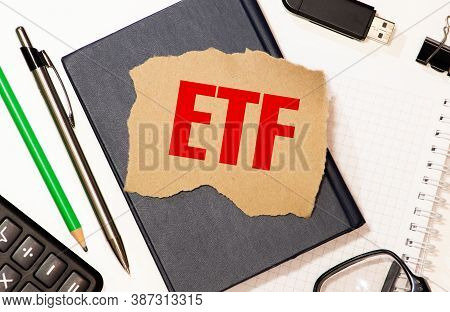 Business And Finance Concept. Top View Of Calculator, Mobile Phone, Pen And Notebook Written With Et