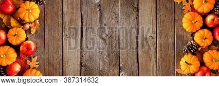 Autumn Double Border With Pumpkins, Leaves And Apples. Above View On A Rustic Dark Wood Background W