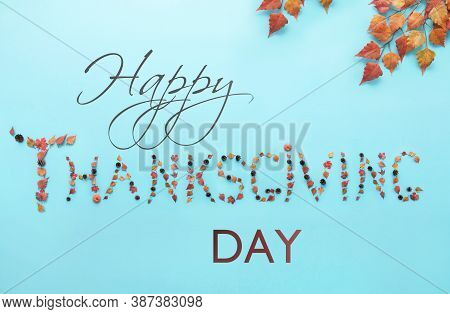 Thanskgiving Greeting Text Made With Autumnal Leaves, Pumpkin And Pine Cones