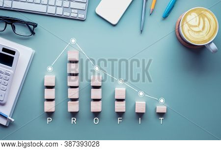 Profit Drop,loss Cocepts With Graph Down On Desk Table.busines Success And Income Result.solution Or