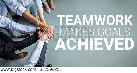 Teamwork. Unrecognizable United Business People Holding Hands Standing Together On Gray Background. 