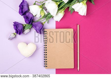 Floral Mockup With Notebook. Flowers And Empty Notebook On Color Paper Background. Tender Eustonia F