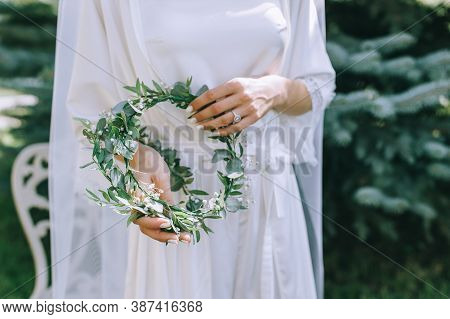 Bride In Wedding Dress With Wedding Bouquet In Hands