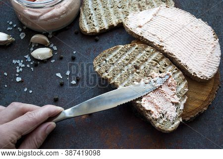 Salmon Pasta On A Knife, Served With Sliced Toasted Bread, Black Pepper, Sea Salt, Garlic On A Linen