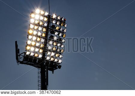 stadium lights reflector and dark blue sky