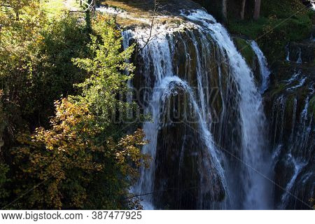 Croatia, Southern Europe, small town Slunj. Beautiful sunny day. Scenic waterfall cascades on the river Sluncica. The concept of ecological, active and photo tourism