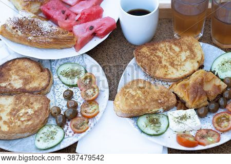 Albanian Traditional Food Served For Breakfast On A Table Top View. Baked Bread With Fruit