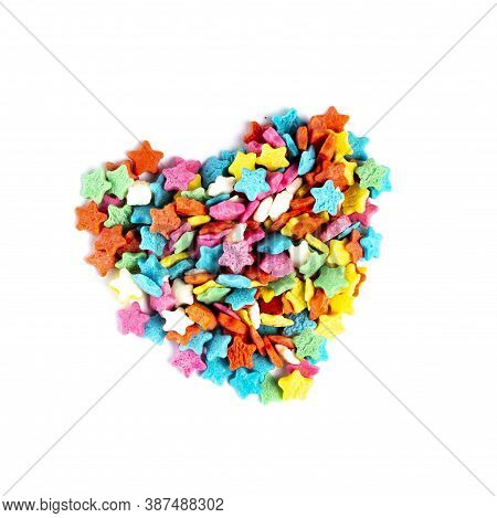 Heart Shape Made Of Multicolored Stars Of Sugar Glaze. Isolate On White, Close-up, Top View. The Con