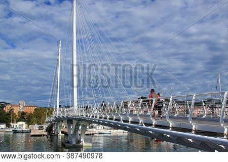 Laspezia, Italy - Summer 2020: Scenic Walk On The Suspension Bridge Over The Port Of Mirabello. High