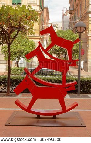 Laspezia, Five Lands, Italy - Summer 2020: Red Rocking Horse Sculpture In A City Park. High Quality 