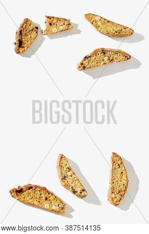 Several Pieces Italian Biscotti Cookies On White Background. Fresh Broken Cookies With Nuts And Drie