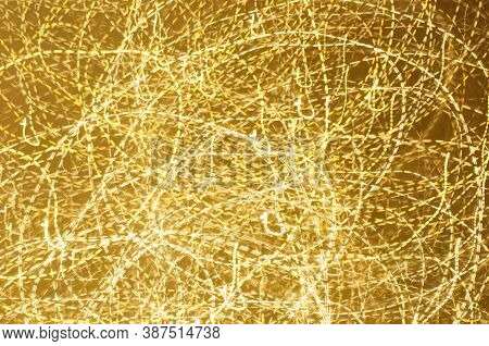 Long Esposure Speed Of Lights In Golden Color And Various Shape. Abstract Festivebackground