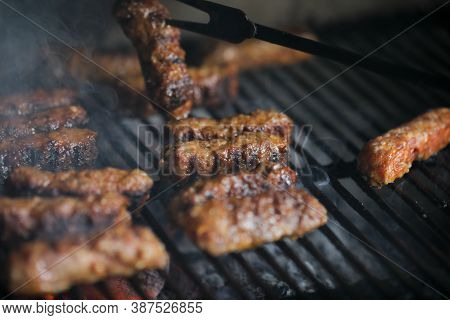 Shallow Depth Of Field (selective Focus) Image With Romanian Traditional Mici (mititei), Grilled Gro