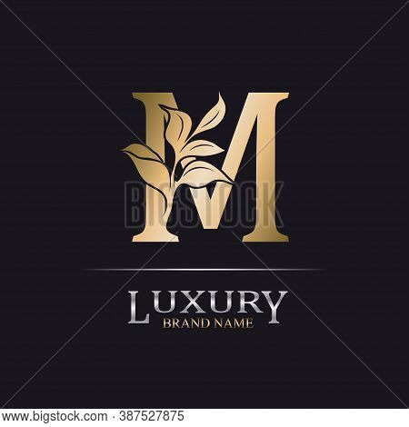 Golden Initial Letter M. Elegant Design Letter M With Floral Branch. Luxury Gold Logo Icon. Vintage 
