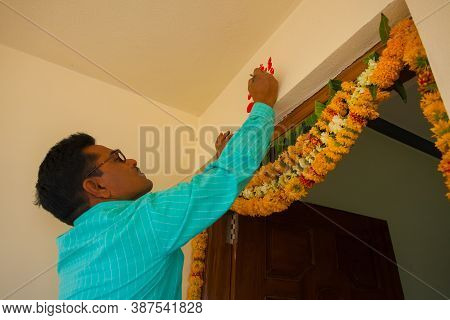 Nanded, Maharshtra/india- 02152012 : Indian Typical House Door Closeup While An Artist Painting Lord