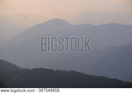 Summer Misty Evening Mountain Tops Silhouettes. Marmaros, Carpathian, Ukraine.
