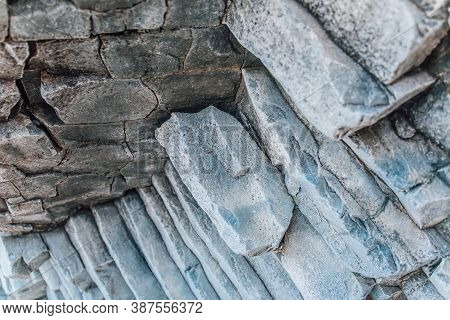 Natural Stone Texture. Basalt Lava Formations Like Columns. Icelandic Typical Natural Background. Vo