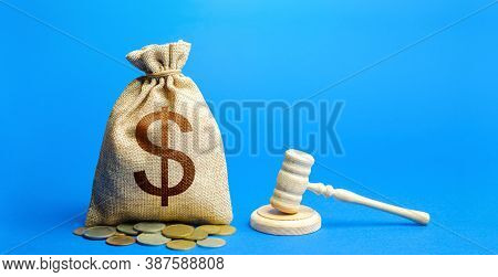 Dollar Money Bag And Judge's Gavel. Litigation, Dispute Resolution, Conflict Of Interest Settlement.