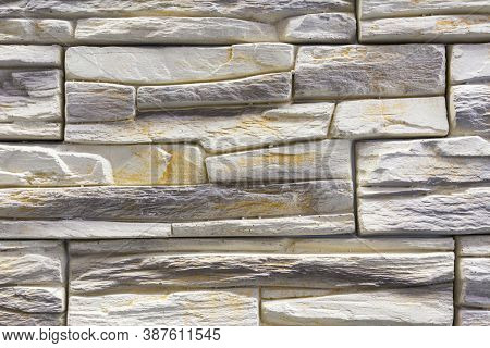 Stacked Stone Wall, Natural Stone Cladding. Stone Wall For Background, Slab Stone Wall Texture. Wall