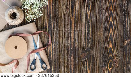 Craft Paper And Tools For Creating And Decorating Gift Packaging. There Is Cardboard, Brown Ribbons 