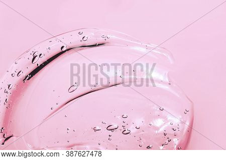 Transparent Pink Cosmetic Smear Of Gel, Serum, Beauty Background Close-up, Macro