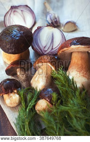 Crop Of Fresh Delicious Porcini Mushrooms On Wooden Background Ready For Cooking. Boletus Edulis (va