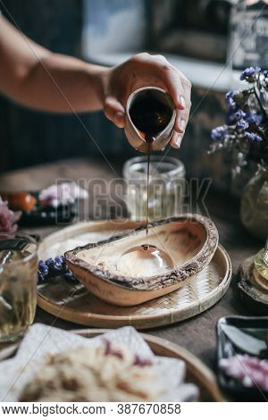 Hand Pouring Brown Sugar Syrup Into Mizu Shingen Mochi Japanese Dessert.a Japanese Style Dessert Wit