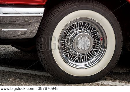 Toronto, Canada - 08 18 2018: Shiny Chrome True Classic Spoked Wheel Disk With Painted In White Coke