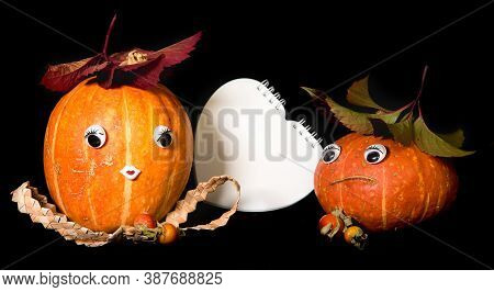 Couple Happy Pumpkins With Eyes And Heart-shaped Notepad, Boy And Girl, Cote Lovers. Black Backgroun