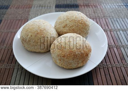 Delicious Fresh Baked Pandesal On A White Plate.