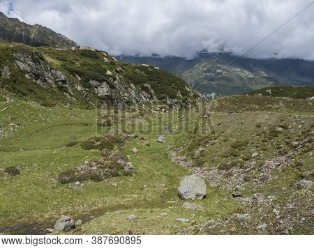 Summer View Of Winding Freigerbach Stream At Green Alpine Mountain Valley In Stubai Tyrol, Austrian 