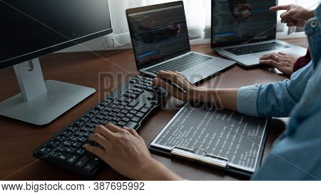 Team Of Programmer Working To Find Solution To Problem And Coding Technologies In A Software Develop