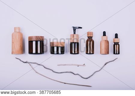 Top View Of Wooden And Glass Bottles Containers Blank Mockup For Skincare Beauty Cosmetic Products F
