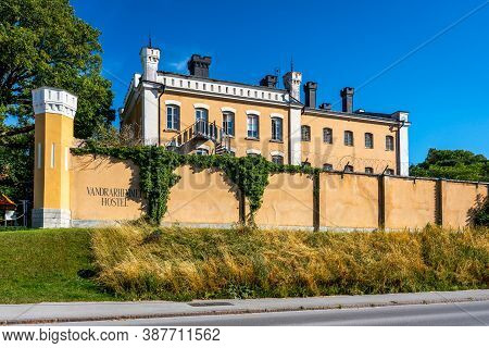 Visby, Sweden - July 27, 2020: Facade View Of The Famous Yellow Landmark Building Sjumastarn. An Old