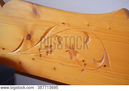Detail Of Decorative Carved Wooden Seat Back Of A Traditional Bench