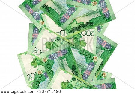 2000 Kazakhstani Tenge Bills Flying Down Isolated On White. Many Banknotes Falling With White Copysp