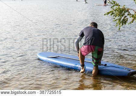 Standup Paddleboarding Are On The River Moscow, Strogino.