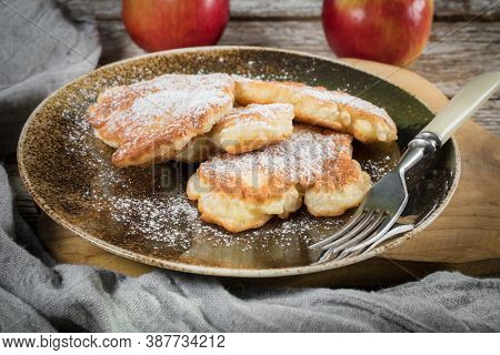 Sweet Pancakes Made Of Apple, Milk And Flour.