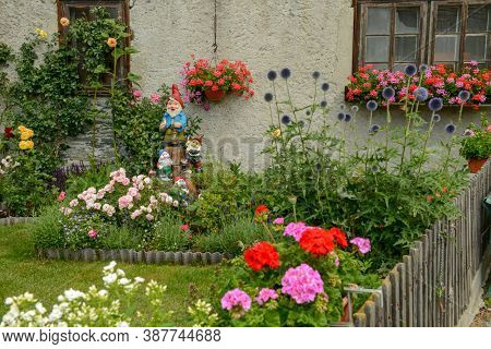 Garden Gnomes Of A Traditional House At Tasch Near Zermatt On The Swiss Alps