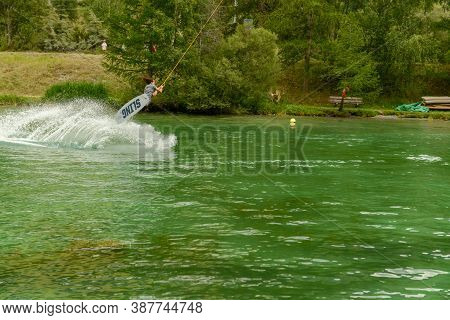 Man Practicing Wakeboard On The Lake At Tasch In The Swiss Alps