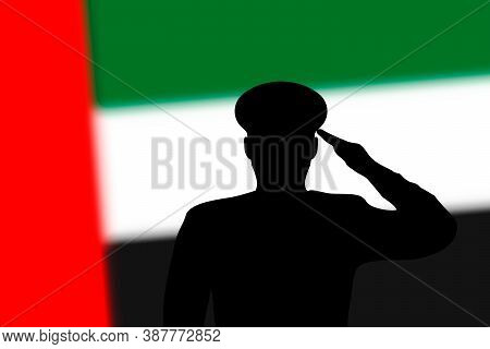 Solder Silhouette On Blur Background With United Arab Emirates F