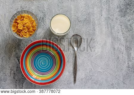 Cornflakes With Milk In A Colorful Plate