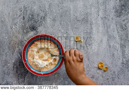 Cornflakes With Milk In A Colorful Plate