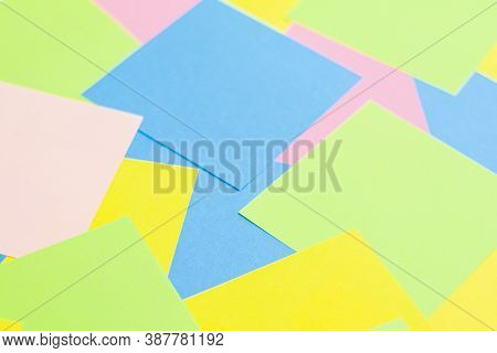 A Set Of Office Work Related Rainbow Colored Paper Sticky Notes. Isolated On Cork Background.