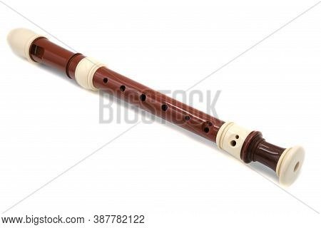 Brown Flute Recorder On A White Isolated Background